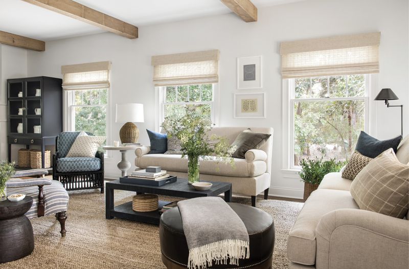 On the Bright Side: Originally hidden behind a central structural wall, the light, bright sitting room welcomes visitors into the home and provides a clear contrast from the den.