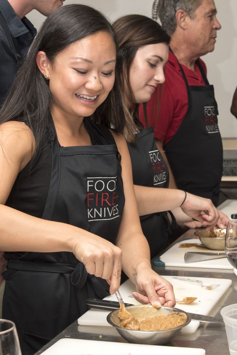 Vy Doan mixes the hoisin peanut sauce.