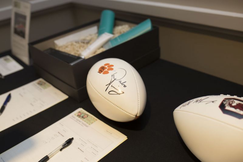 A signed football from Clemson University and the 2016 NCAA National Champion football head coach, Dabo Swinney.