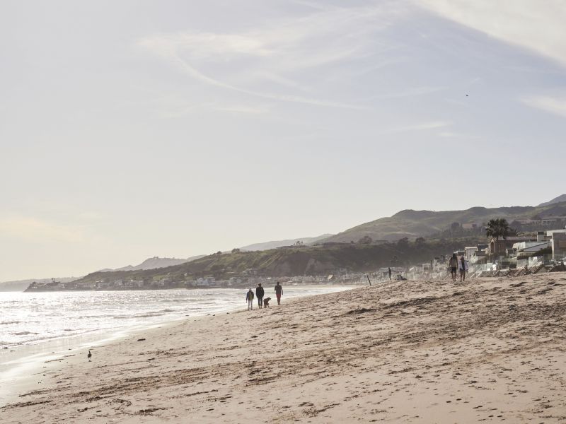 The Pacific sparkles near the Santa Monica Mountains during a sandy stroll at Malibu Lagoon State Beach.