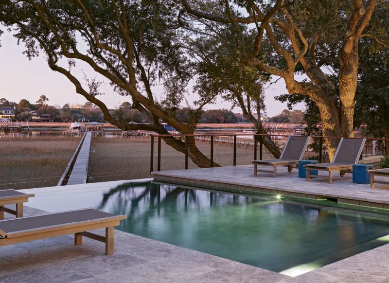 The infinity pool appears to spill into the marsh and Intracoastal Waterway.