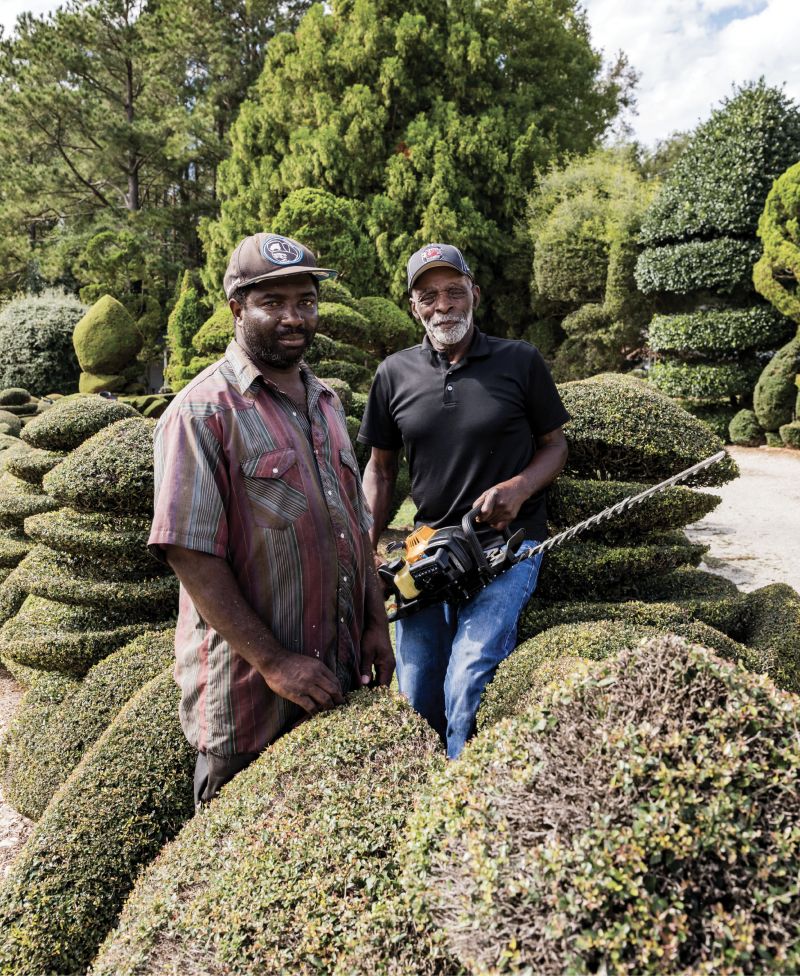 Helping Hand: “One thing about life: no matter who you are, one day Old Man Time will slow you down,” says Fryar, who will turn 80 in December. He’s pictured here with his longtime assistant, Michael Baker.