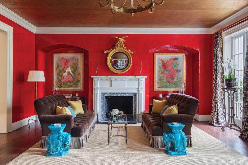 Well Red: The formal drawing room on the second floor would have originally been the home’s main living and dining room when the downstairs space was used for business. The previous owner employed artist Robert Shelton to create the red Venetian plaster walls and gold-leaf ceiling, and the Amlings hired him to restore both almost 20 years later.