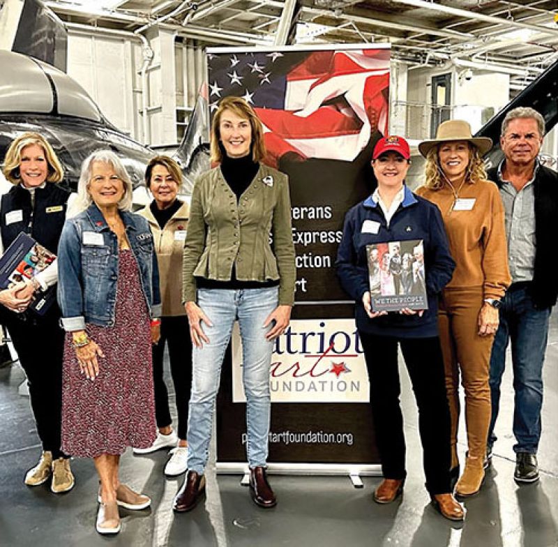 An army of volunteers help staff events, including (left to right) Cathy Sippell, Susan Marlowe, Mary Regner, Whyte, Mille Haehl, Phyllis Sheffer, Martha Waggoner, and General Charles Baldwin on the Yorktown on Veterans Day 2023.
