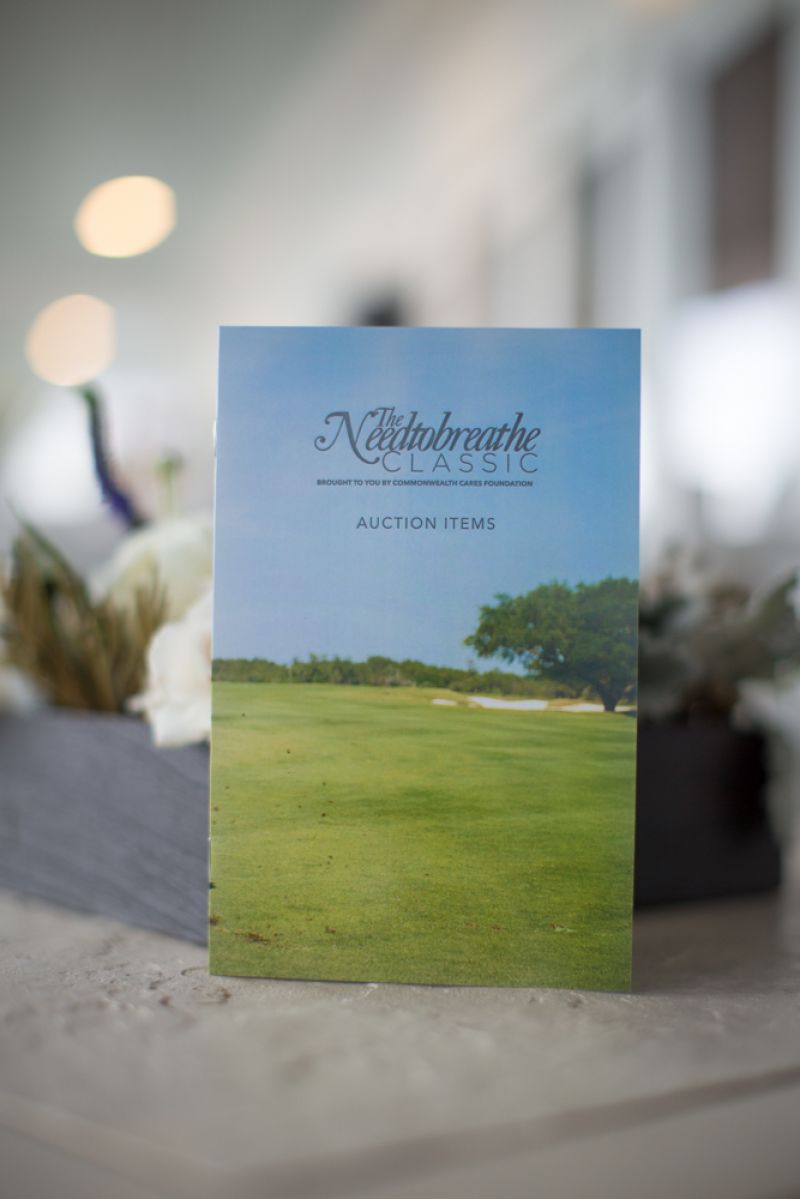 Guests received pamphlets outlining items available for the silent auction, including Kacey Musgraves concert tickets and Kevin Durant signed tennis shoes.