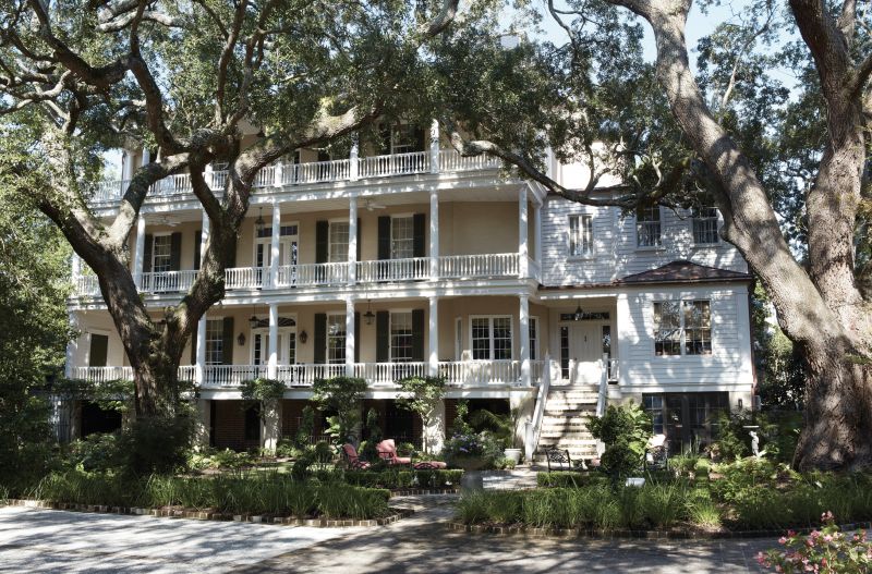 Living Large: This South of Broad single house dates to the late 1700s. At some point in its long history, its Georgian architectural bones were augmented with Greek Revival touches, such as the three wide piazzas. The newest addition is a second story above the rear entryway, designed by Charleston architect Glenn Keyes to make room for an enlarged primary bedroom suite.