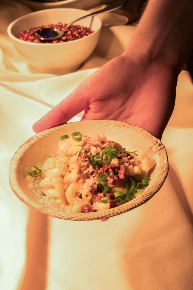 At one dinner station, guests could make a bowl of mac and cheese, adding an array of different toppings.