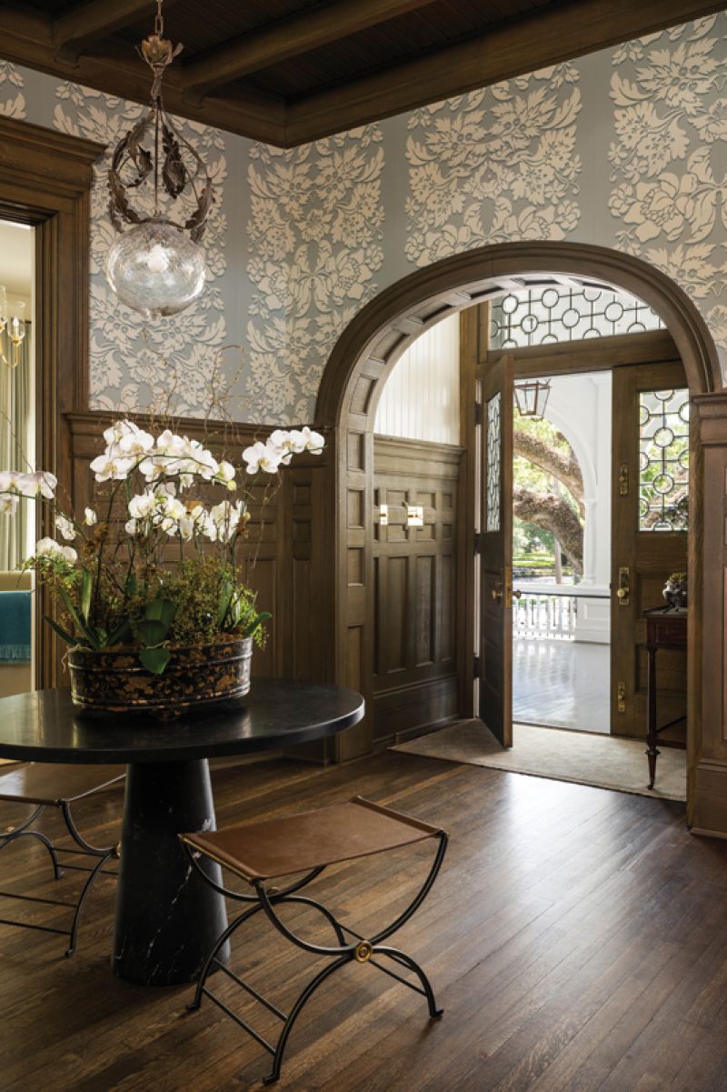 The foyer’s wallpaper sets the tone for the inn’s calm, cool palette, while its ornate graphic honors the property’s Victorian roots.