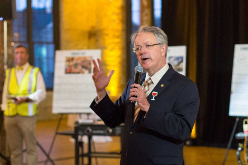 Mayor John Tecklenburg giving a speech on the importance of supporting the local community.