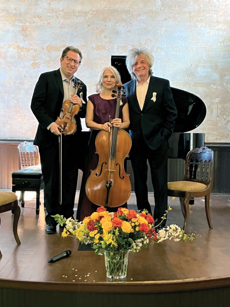 With friends and College of Charleston colleagues Natalia Khoma and Volodymyr Vynnytsky wearing Ukrainian flag pins in support of Ukraine at a March 2022 performance in Lancaster, South Carolina.