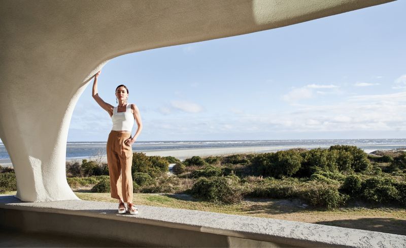 IN HER ELEMENT - A.L.C. “Lia” wide-strap racerback top, $225 at Gwynn’s of Mount Pleasant; Scotch &amp; Soda tailored linen pants, $195 at Scotch &amp; Soda; Vince “Westport” leather platform sandals, $225 at Shoes on King; Mona Assemi 14K gold-plate statement earrings, $475 at Gwynn’s of Mount Pleasant; Mazza Company 14K gold and moonstone ring with diamond accents, $3,450 at Croghan’s Jewel Box
