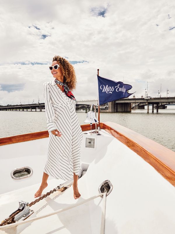<b>Take the Bow: </b>Birgitte Herskind “Geraldine” dress, $315 at Souchi; Dior “DiorBobby Butterfly” sunglasses, $440 at Gwynn’s of Mount Pleasant; Swells “Red + Black Gameday” scarf, $68 at ShopSwells.com; Freida Rothman “Glistening Stud” hoop earrings, $295 at Croghan’s Jewel Box; and J. Catma “Barrel” ring, $230 at Grand Bohemian Gallery.