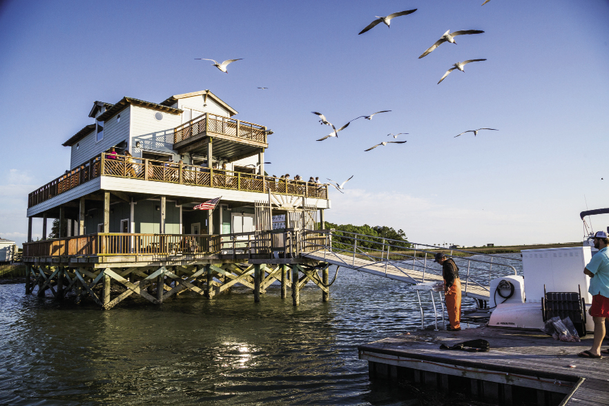 Sunset Cay  Yacht Club: At the south end of Folly, turn right onto 9th Street and follow the paved road to the end. Upstairs from the marina, you’ll find this casual hangout with fried seafood and cheap beers set against the backdrop of the Intracoastal Waterway. 66 W. 9th St. Ext.  Monday-Friday: 4-9 p.m., Saturday-Sunday: Noon-9 p.m. (843) 588-0001 Note: Membership requires $5 in dues and a 24-hour waiting period.