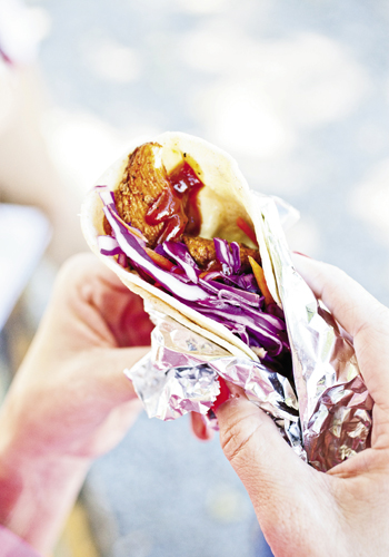 a fried chicken taco with slaw